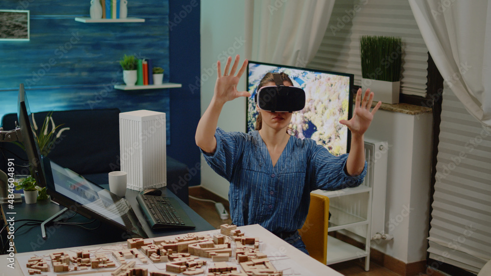 Poster architect using vr glasses for building design with blueprint plan on table. construction engineer w