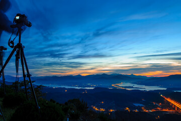 Taking a photo of sunrise in the Dumulmeori, South Korea.