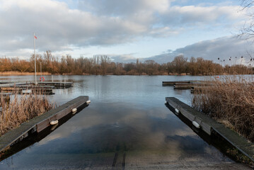 Naklejka premium Slipway into the lake in autumn.