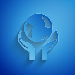 Paper cut Human hands holding Earth globe icon isolated on blue background. Save earth concept. Paper art style. Vector