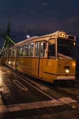 Night tram driving through the city