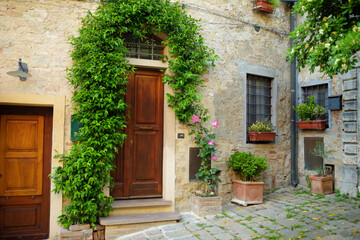 Fototapeta na wymiar Charming old streets of Volterra, known fot its rich Etruscan heritage, located on a hill overlooking the picturesque landscape. Tuscany, Italy.