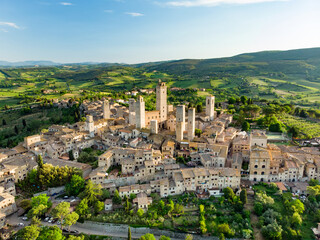 Aerial view of famous medieval San Gimignano hill town with its skyline of medieval towers,...