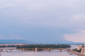 Bridge connecting two cities with an island
