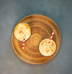 Yellow Indian mango yoghurt drink Mango Lassi or smoothie with turmeric and saffron.