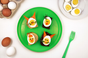 Fun food for kids. Funny egg sandwiches for kids. Rabbit bunny and chicken chick shaped sandwiches.
Healthy eating for children. Creative idea for kids breakfast.