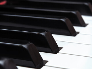 Piano keys close-up. A grand piano keyboard. The shallow depth of field. Selective focus.