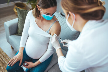 Pregnant Vaccination. Pregnant Woman In Face Mask Getting Vaccinated . Doctor Giving Coronavirus...