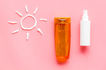 Suntanning lotion with cream in shape of sun, top view