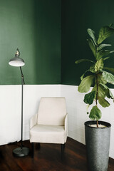 room in house with modern interior design. Stylish and modern scandinavian interior of white chair with plant and lamp