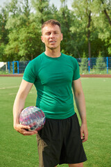 sportive man on football pitch