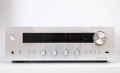 Front shot of silver music receiver isolated on white background.Radio stereo receiver.