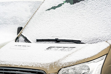 Front of a snow covered car