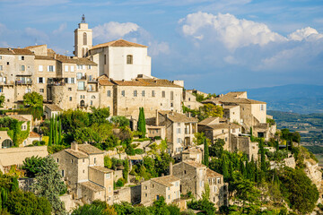 Fototapeta na wymiar Saint-Firmin church in Gordes village in the Luberon valley during summer in Provence, France