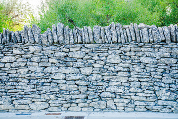 Wall in dry stones near the village of Gordes and the Village des Bories in Provence, France