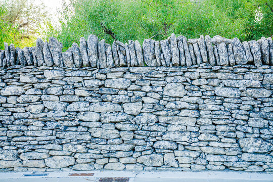 Wall in dry stones near the village of Gordes and the Village des Bories in Provence, France