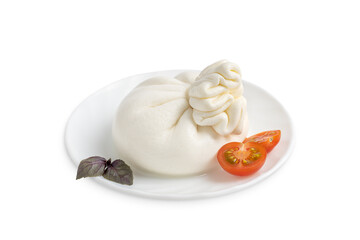 Italian burrata homemade organic white soft milk cheese served with sliced red cherry tomatoes and basil leaves on plate as appetizer or snack isolated on white background