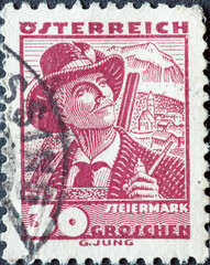 Austria - circa 1934: a postage stamp from Austria, showing a portrait of a hunter with a rifle...