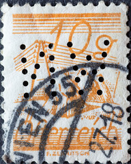 Austria - circa 1925: a postage stamp from Austria, showing straw drying on the field and power line