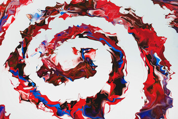 A spiral of burgundy, red, blue colors on a white background. Modern abstract painting. An edited fragment of a work of art. Abstract colorful painting with liquid acrylic on canvas. 