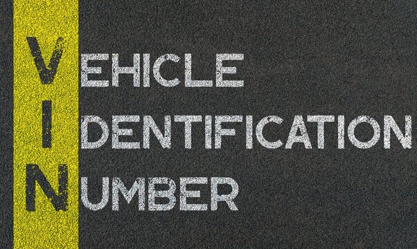 Vehicle Identification Number (VIN) Written Over Road Marking Yellow Paint Line. Transport Acronyms And Abbreviations.