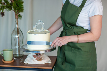 pastry chef with cake and baking tools