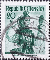 Austria - circa 1948: a postage stamp from Austria, showing a woman in national costume from the region: Vorarlberg Montafon