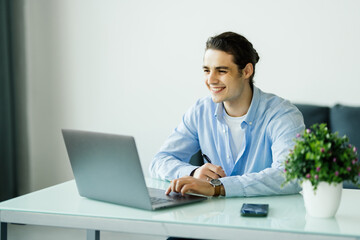 Entrepreneur working with a laptop in a office or home