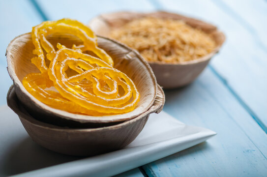 Indian popular sweet - Jalebi, served in a eco-friendly bowl with spicy Sev Bhujia (fried noodles).