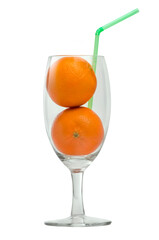 Whole orange fruits on the juice glass with straw. Concept for 100% natural and freshly squeezed orange juice. 