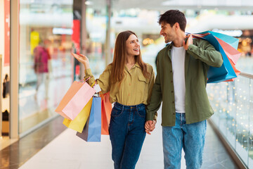 Family Couple Shopping Together, Wife Showing Clothing Store In Mall