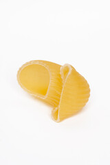  Tasty uncooked pasta on white background.