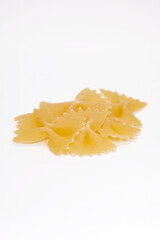  Tasty uncooked pasta on white background.