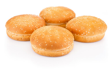 Four hamburger buns with sesame isolated on white background