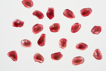 Fototapeta na wymiar pomegranate grains on white background