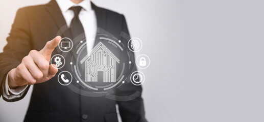 Businessman hold house icon.Smart home controlled, intelligent house, and home automation app...