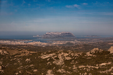 Full panoramic of Olbia's skyline with tavolata Island in the back