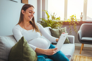 Pregnancy And Technology. Pregnant Lady Using Laptop At Home, Browsing Internet, Shopping Online Or Reading Maternity Blog, Side View Shot , Close Up