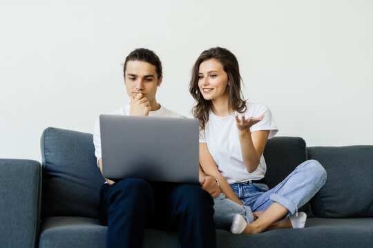 Young happy couple video calling on computer