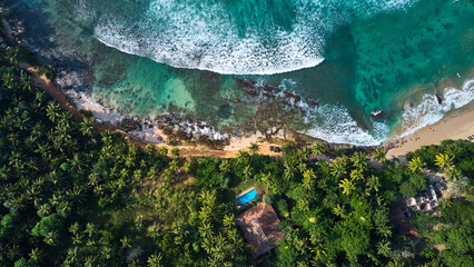 Aerial view of Hiriketiya Beach in Dikwella. Blue beach in Sri Lanka. Indian Ocean. High quality 4k footage