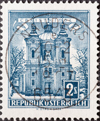 Austria - circa 1958 : a postage stamp from Austria, showing the historic building: Church of...