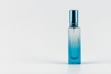 unbranded transparent perfume blue glass sprayer minimal style concept. blue flacon of essence...