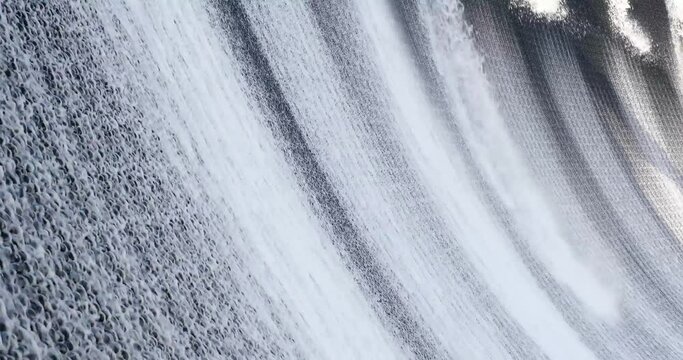 Waterfall cascade in slow motion and alternative energy closeup
