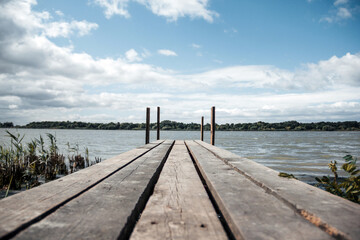 Fototapeta premium Beautiful wooden pier near the river bank