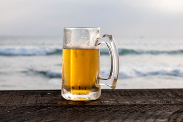 beer glass on ocean background