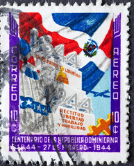 Dominican Republic - circa 1944 : a postage stamp from Dominican Republic , showing the flag of the...