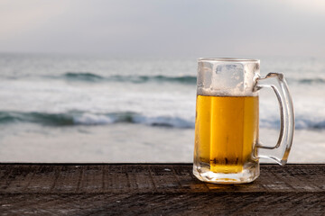 beer glass on ocean background
