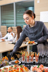 waiter serving a banquet in the office