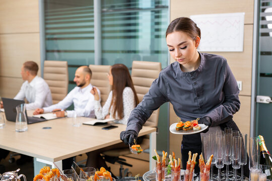 waiter serving a banquet in the office