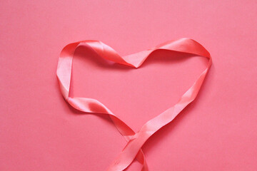 Valentine's Day. Ribbon hearts on pink background. Flat lay, top view, copy space